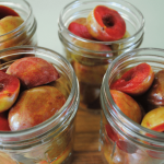 plums halves in glass jars